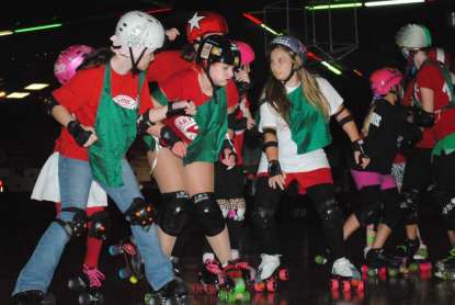 Photo by Christina Kelso For the Times-Union Blockers (from left) Dahlia "Cookie" Cook, 13, Madison "Wednesday At Emz'" Wolfe, 15, and Braice "Scrat" Bays, 12 try to prevent the opposing team's jammer from breaking through their pack.